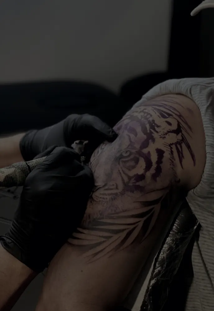 Design being tattooed